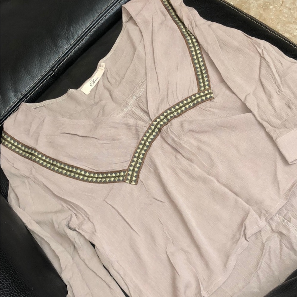 Cute high low top. Never worn
